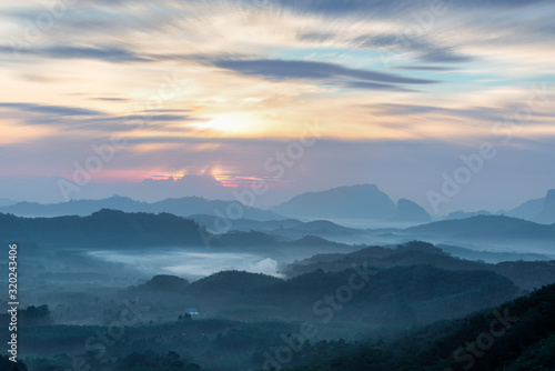 Mountain Landscape at sunrise   with view of palm and rubber plantations  Relaxing mood  Southern of Thailand