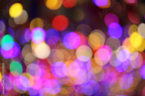 colorful bokeh light of christmas tree illuminated light for back ground use