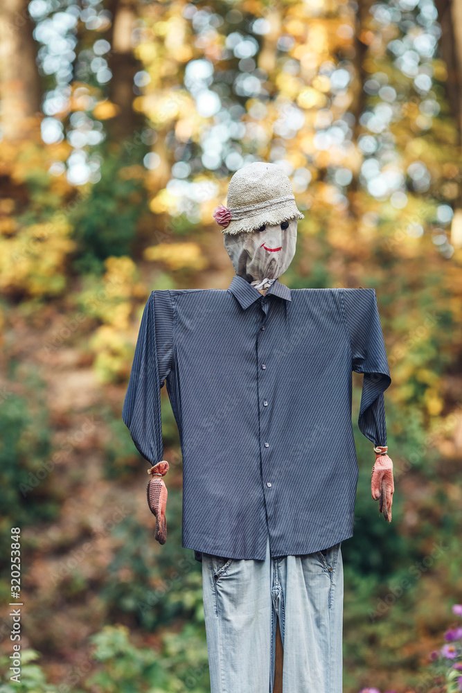 scarecrow from old clothes in the garden. scarecrow from old clothes in the garden.