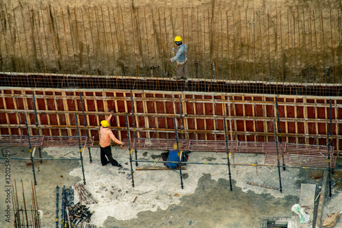 Fototapeta Naklejka Na Ścianę i Meble -  Aerial shot of of a construction work site on a real estate project in India
