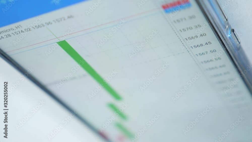 trader use mobile working with forex and cryptocurrency data and bar chart, invester concept. trader use mobile working with forex and cryptocurrency data and bar chart, invester concept.