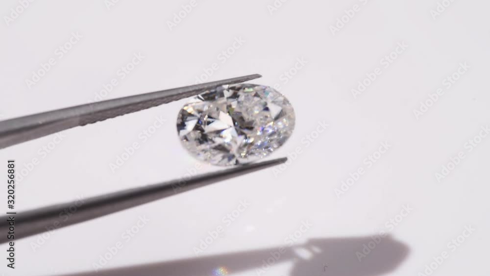 Oval Cut Diamond in Tweezers Oval Cut Diamond in Tweezers