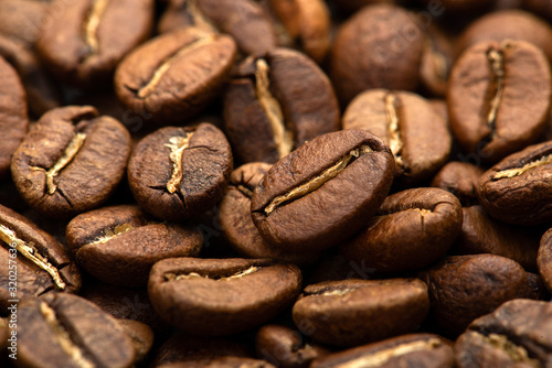 Coffee beans close-up background. Fresh roasted