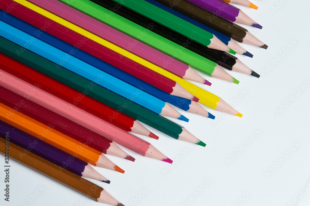 multicolored pencils on a white background.