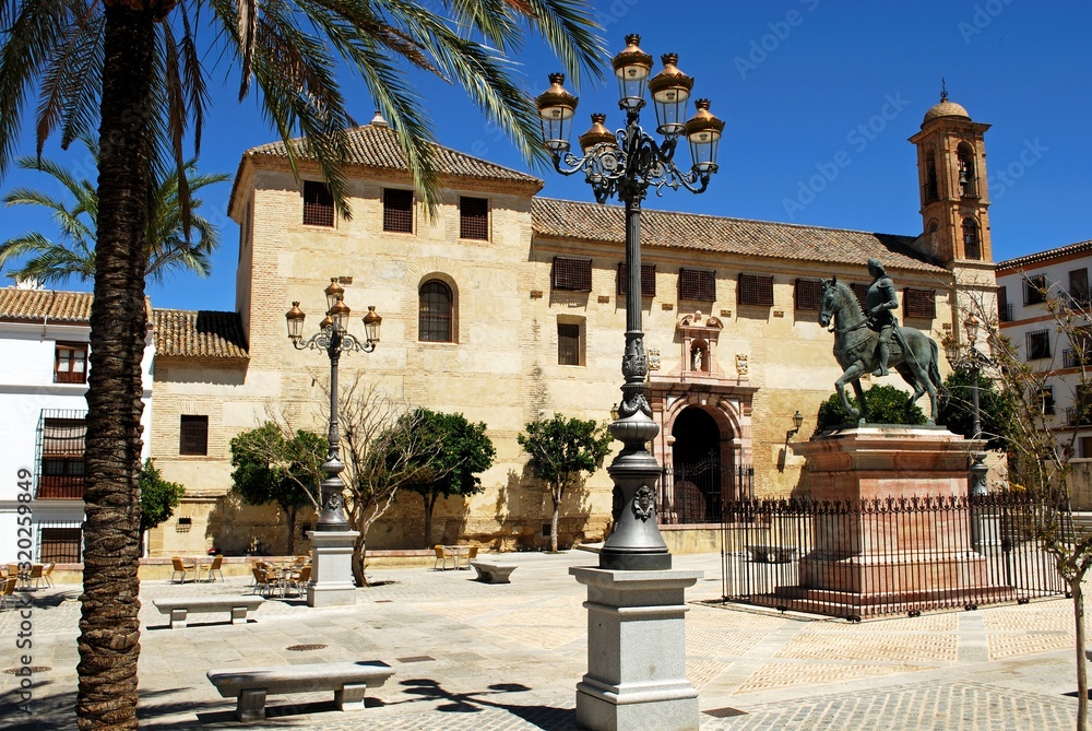 View of the convent (Convento de Santa Catalina) in the Plaza Guerrero Munoz and a statue of Fernando I (King of Aragon), Antequera, Spain.