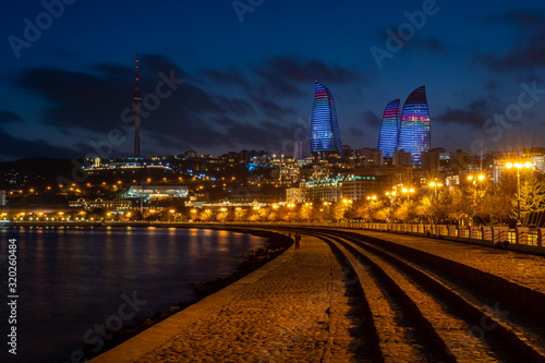 Night view of Baku with the Flame Towers skyscrapers
