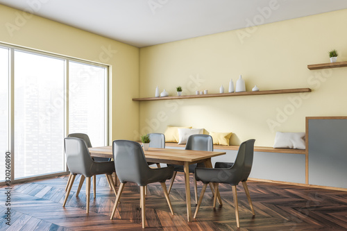 Yellow panoramic dining room corner with cabinet