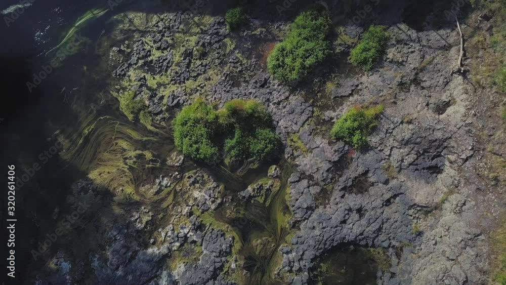 Aerial view rising over the top of Haruru Falls in New Zealand Aerial view rising over the top of Haruru Falls in New Zealand