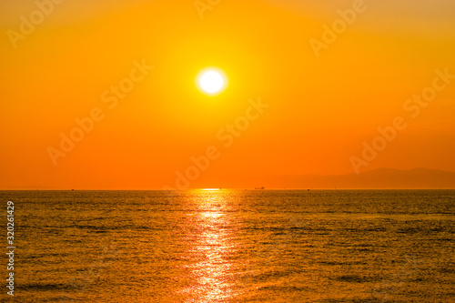 Bright orange sunset over the sea.