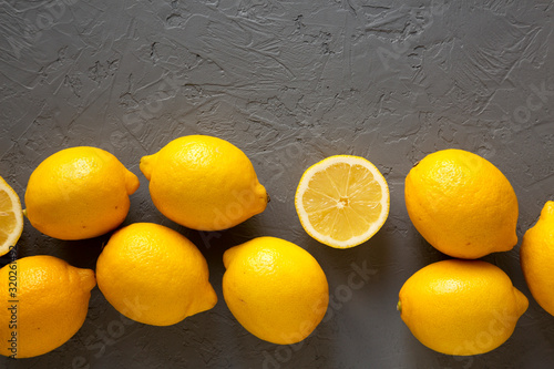 Konstfotografi Fresh Ripe Yellow Organic Lemons on gray background, top view