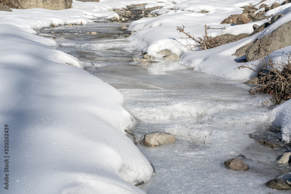Channel of a frozen mountain river Channel of a frozen mountain river