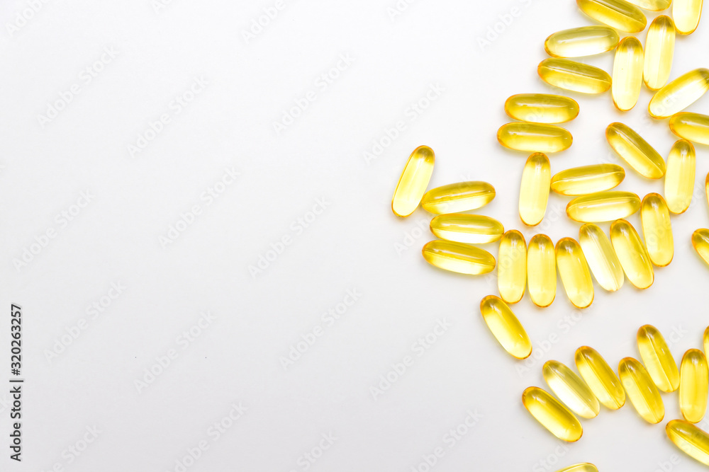 Pile of capsules Omega 3 on white background with copy space for your text Pile of capsules Omega 3 on white background with copy space for your text