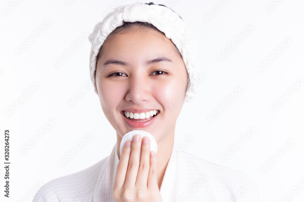 Pretty asian woman clean beautiful face by wiping, use cotton pads, cleansing lotion, facial toner. Attractive beautiful young lady has nice facial skin, bright face skin. Facial skin care concept. Pretty asian woman clean beautiful face by wiping, use cotton pads, cleansing lotion, facial toner. Attractive beautiful young lady has nice facial skin, bright face skin. Facial skin care concept.