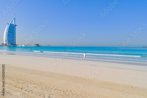 Obraz na płótnie Burj Al Arab Hotel By Beach Against Clear Blue Sky