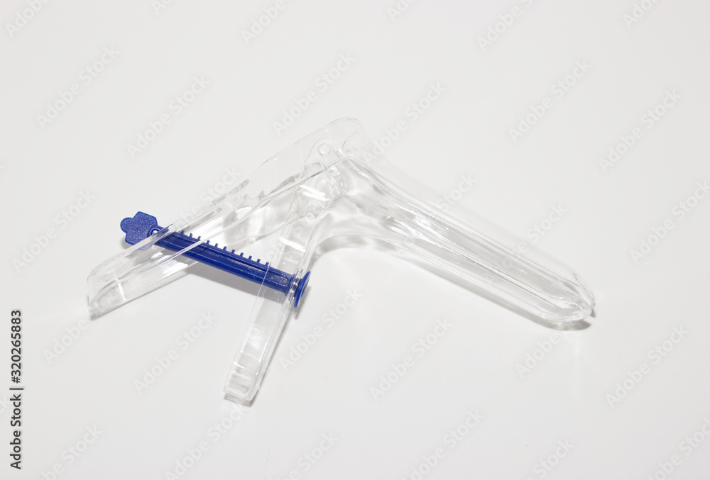 Gynecological mirror plastic transparent on a white background