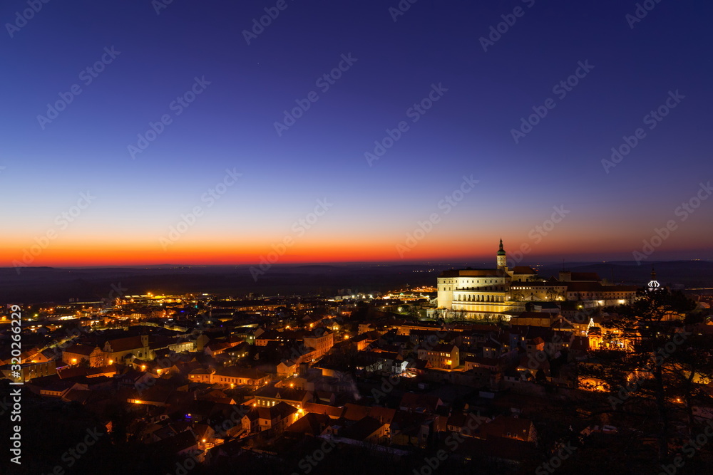 Obraz premium Evening view of Mikulov, Chateau in Mikulov view from Sv. Kopecek. South Moravia, Czech Republic.