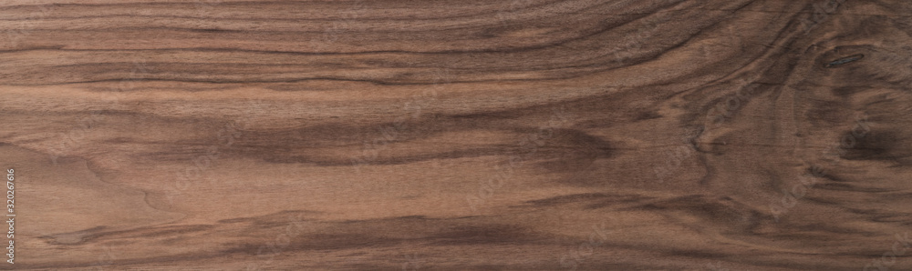 Texture of sanded raw black walnut wood without finish Texture of sanded raw black walnut wood without finish