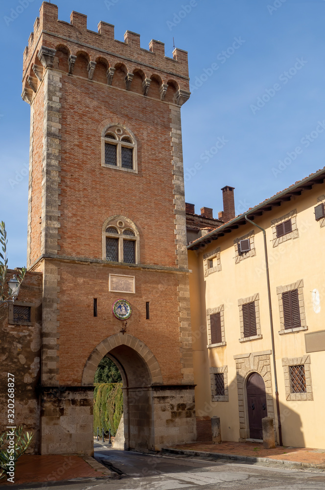 Entrance or exit to the medieval village of Bolgheri, Tuscany, Italy. Viewed from inside village.