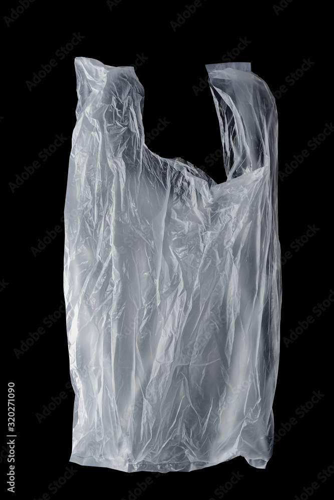 crumpled single-use plastic bag on black background, polyethylene plastic, green environment concept crumpled single-use plastic bag on black background, polyethylene plastic, green environment concept