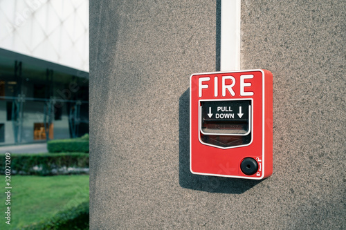 fire alarm system on wall at open air shopping plaza, shallow depth of field