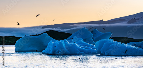 Amazing sunset over the famous glacier lagoon Jokulsarlon, view of icebergs floating. Location: Jokulsarlon glacier lagoon, Iceland. Artistic picture. Beauty world. Travel concept