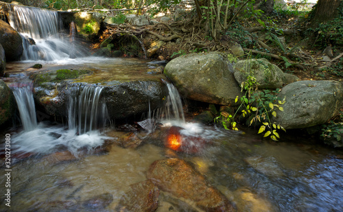 Small stream with a waterfall