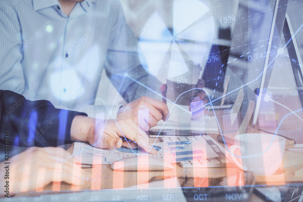 Multi exposure of chart with man typing on computer in office on background. Concept of hard work. Multi exposure of chart with man typing on computer in office on background. Concept of hard work.