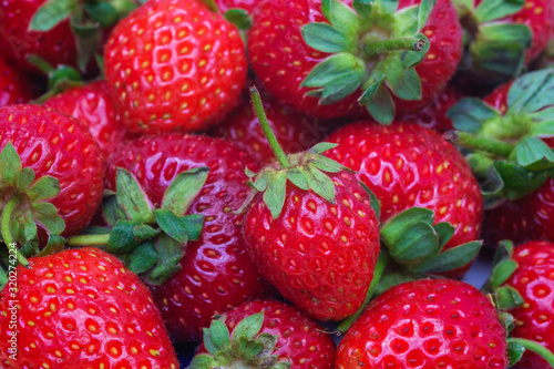 Strawberry berries close up. Visible structure and small details.