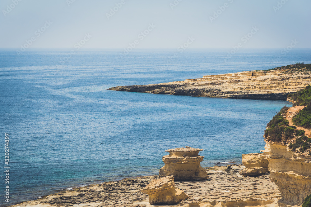 Calm sea water near Maltese rocks
