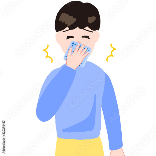 ハンカチをあててクシャミする男の子