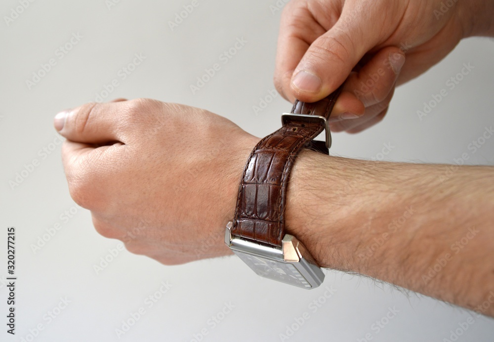 Obraz premium Fastening leather wrist watch strap isolated on white background