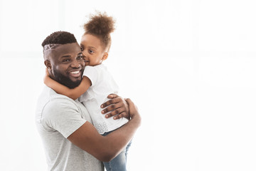 Beautiful afro family posing over white background