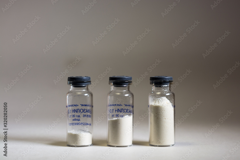 Three antibiotic-filled (cefazolin) in glass vials. Three antibiotic-filled (cefazolin) in glass vials.