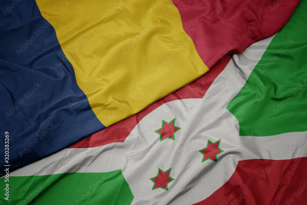 Fototapeta premium waving colorful flag of burundi and national flag of chad.