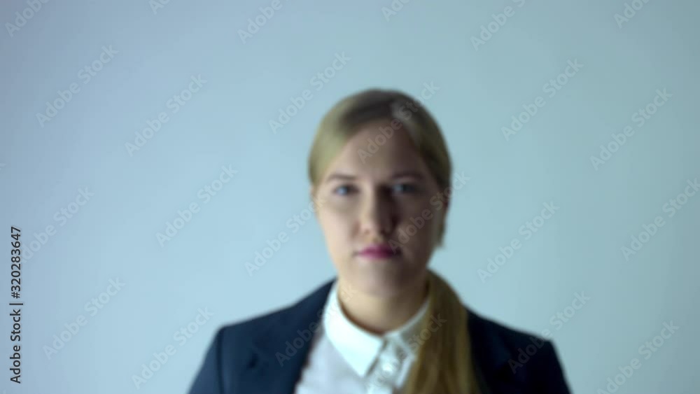 Blurred business woman zoom in effect in focus in professional studio Blurred business woman zoom in effect in focus in professional studio