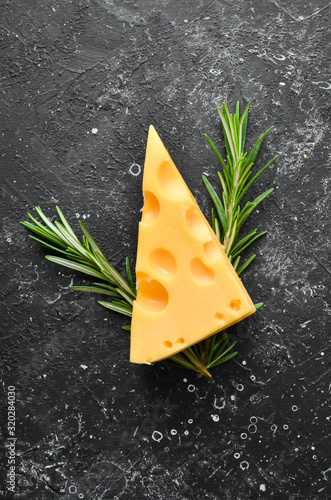 Yellow cheese with holes. Dairy products. Top view. Free space for your text. photo