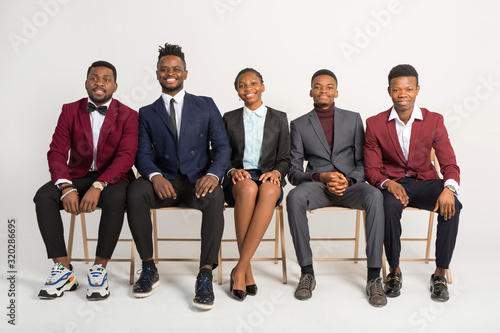 beautiful african people in suits on a white background