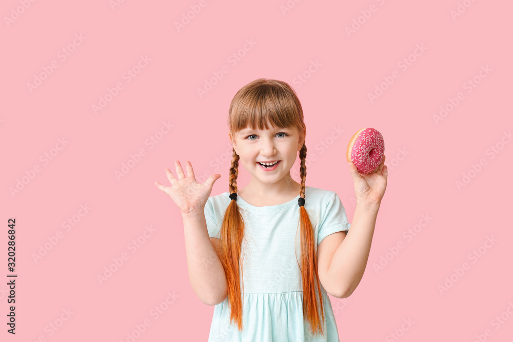 Funny little girl with donut on color background Funny little girl with donut on color background