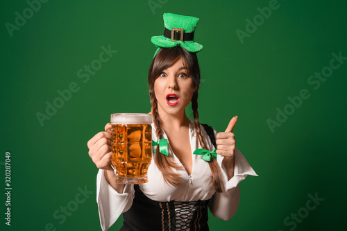 Funny young woman with beer...