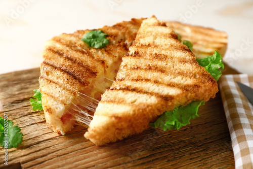 Tasty sandwiches with cheese on table, closeup