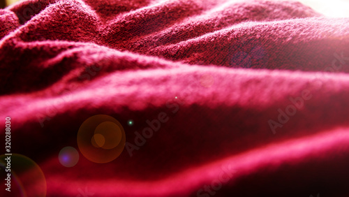 close up soft red towel. selective focus with blurred foreground and background.