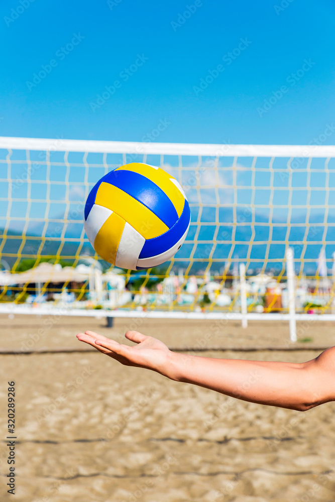 Playing Volleyball On The Beach