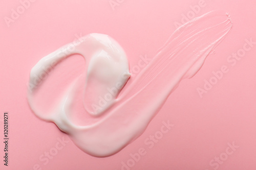 Sample of cream on color background