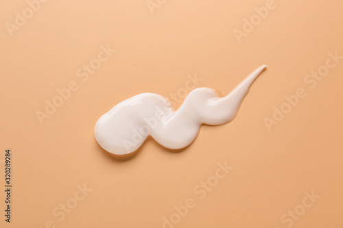 Sample of cream on color background