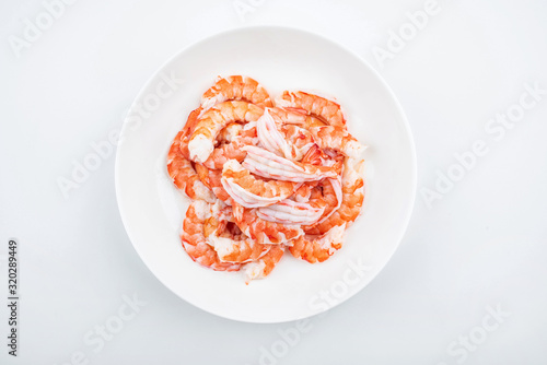 A plate of shrimp with open back and shrimp line