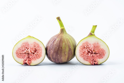 Fresh fruit fig slices on white background