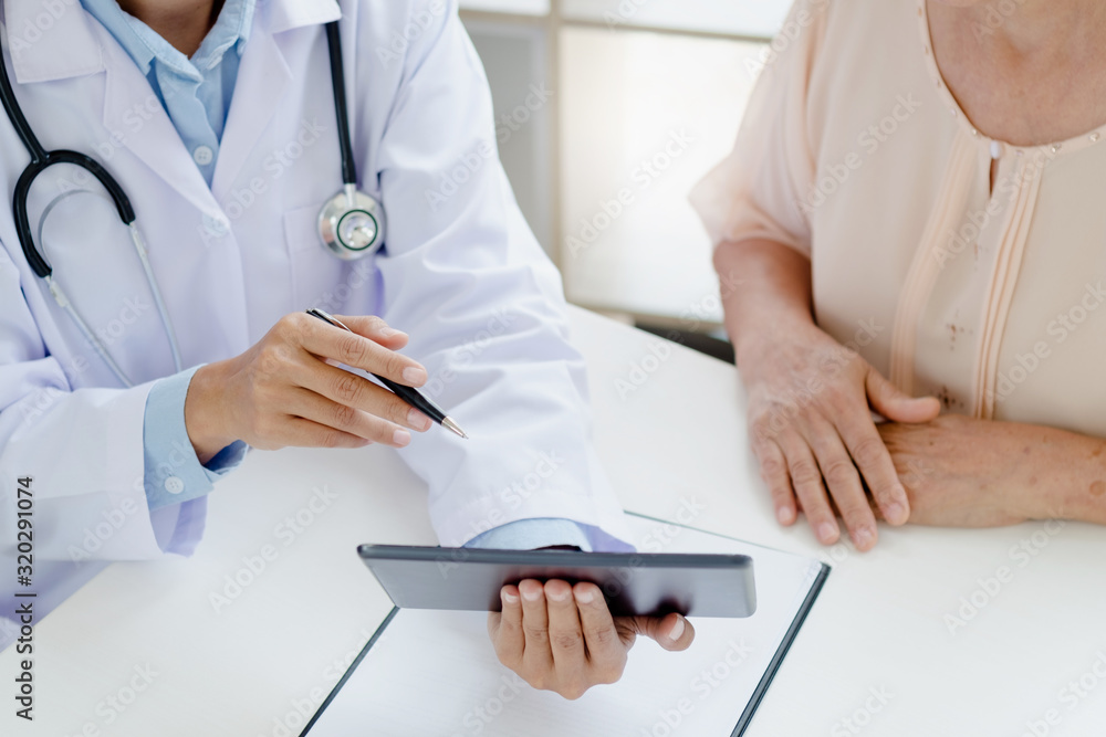 doctor and mature patient having a consulting in the hospital doctor and mature patient having a consulting in the hospital