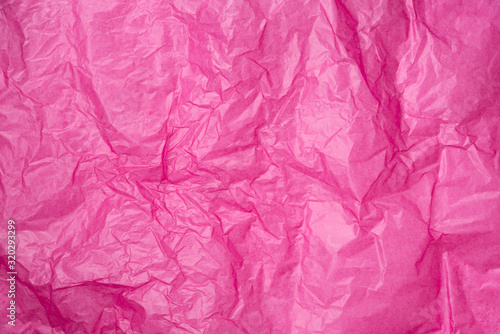 abstract background pink crumpled transparent paper on white paper.