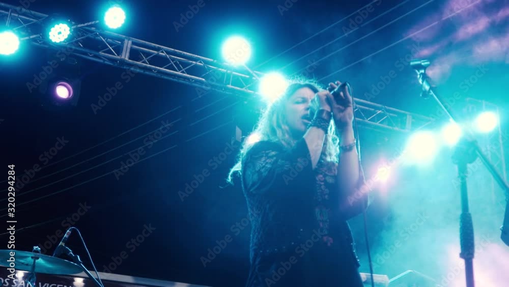 Close Up In Slow Motion Of Female Rock Singer Singing A Song In An close-up-in-slow-motion-of-female-rock-singer-singing-a-song-in-an