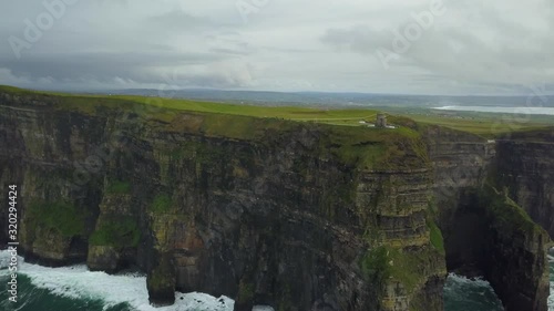 Slowly flying toward the Cliffs of Moher from far out
4K 29fps photo